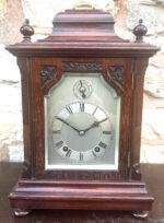Perfect timepiece for any home this clock is made of solid mahogany with fretted sides. W & H movement.