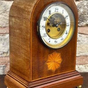 Very good oak cased clock Wonderful enamel dial deadbeat escapement French movement Visible escapement Brass ball feet Arched top 8-Day German striking movement Inlaid satinwood and boxwood inlay Dial wonderfully clean and bright Movement circa 1900 Working order Measures 32.5cm high by 21cm wide & 24.5cm deep Stunning case with satinwood and boxwood inlay, standing on brass bun feet. Very nice original enamel dial with number numerals and a visible escapement. Stepped base and arched top, this is a very fine example of this type of clock. Good condition for age, showing slight signs of age please view the many photos make sure happy.