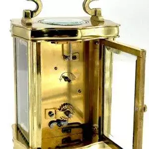 Beautiful slightly smaller sized antique carriage clock. Wonderful piece, it displays very well with its serpentine shaped case and wonderfully clean white enamel dial.