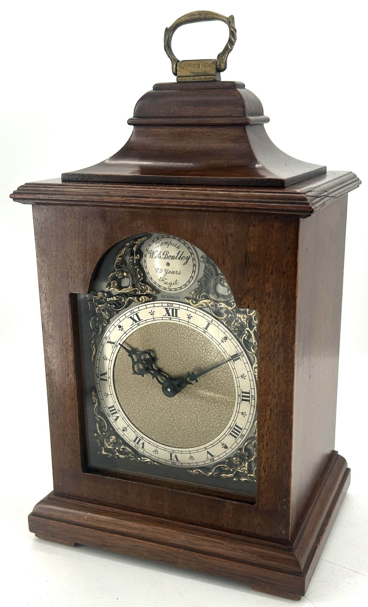Lovely miniature Bracket clock ca 1940. Wonderful original dial and hands. Lovely stepped case with brass carry handle on the top.