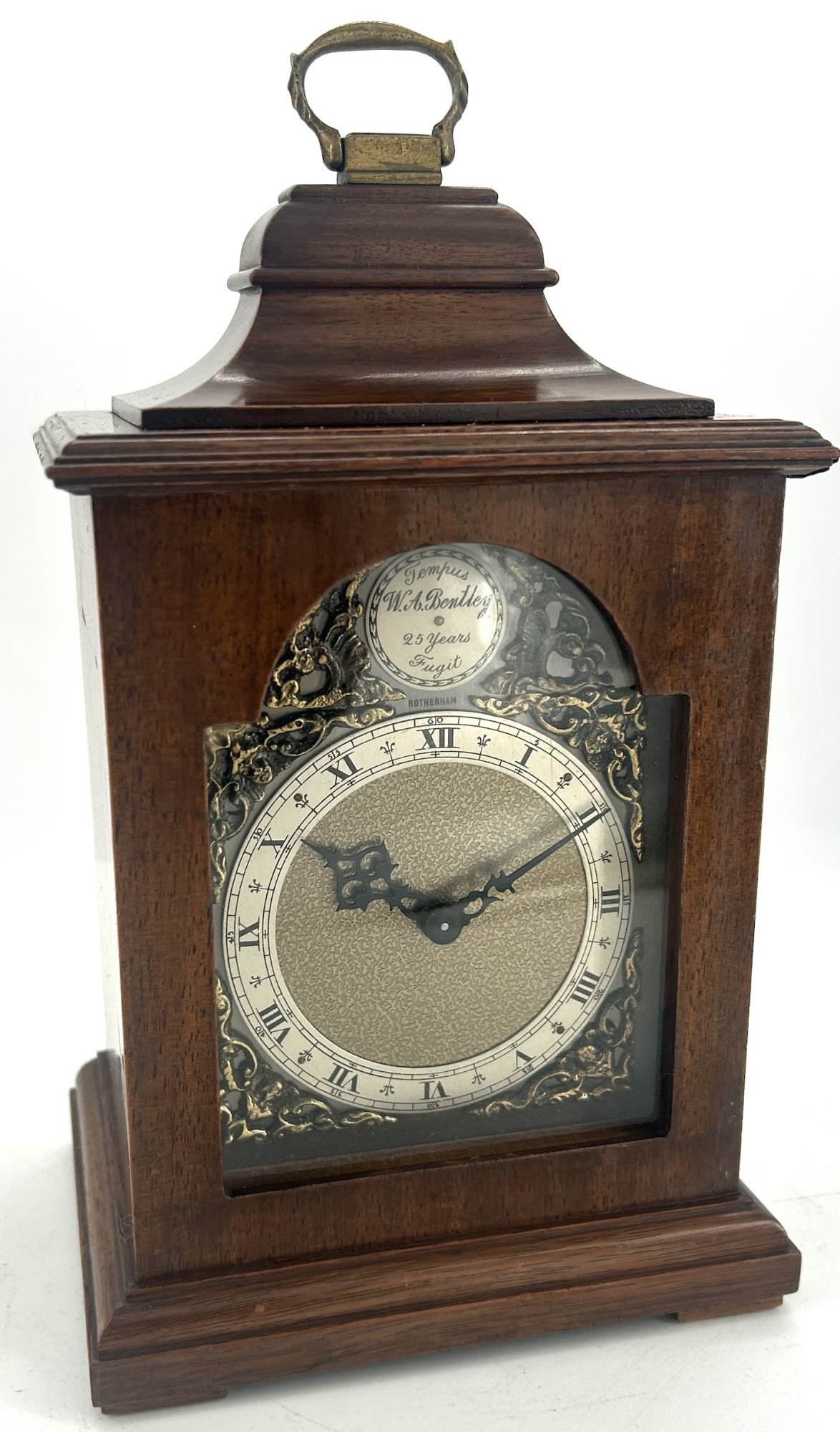 Lovely miniature Bracket clock ca 1940. Wonderful original dial and hands. Lovely stepped case with brass carry handle on the top.