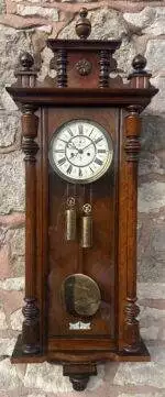 Exquisite Twin weight Vienna Wall clock made by Gustav Becker, ca 1890. Wonderful original enamel dial which has the Gustav Becker logo on and original hands. Classic walnut case with turned finials and stunning pediment.