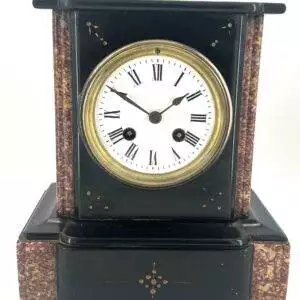 Lovely architectural flat top designed case with gilt etched foliate decoration and red marble borders. 8 day French movement.