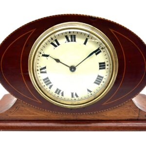 Bring a touch of refined Edwardian elegance to your space with this stunning antique mantel clock.