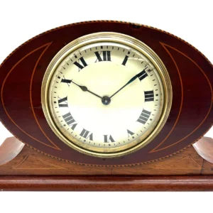 Bring a touch of refined Edwardian elegance to your space with this stunning antique mantel clock.